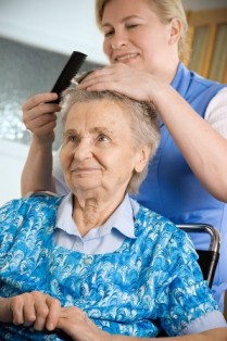 Elderly Women Getting Haircut from Staff